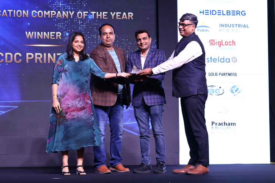 CDC Printers receiving award on stage